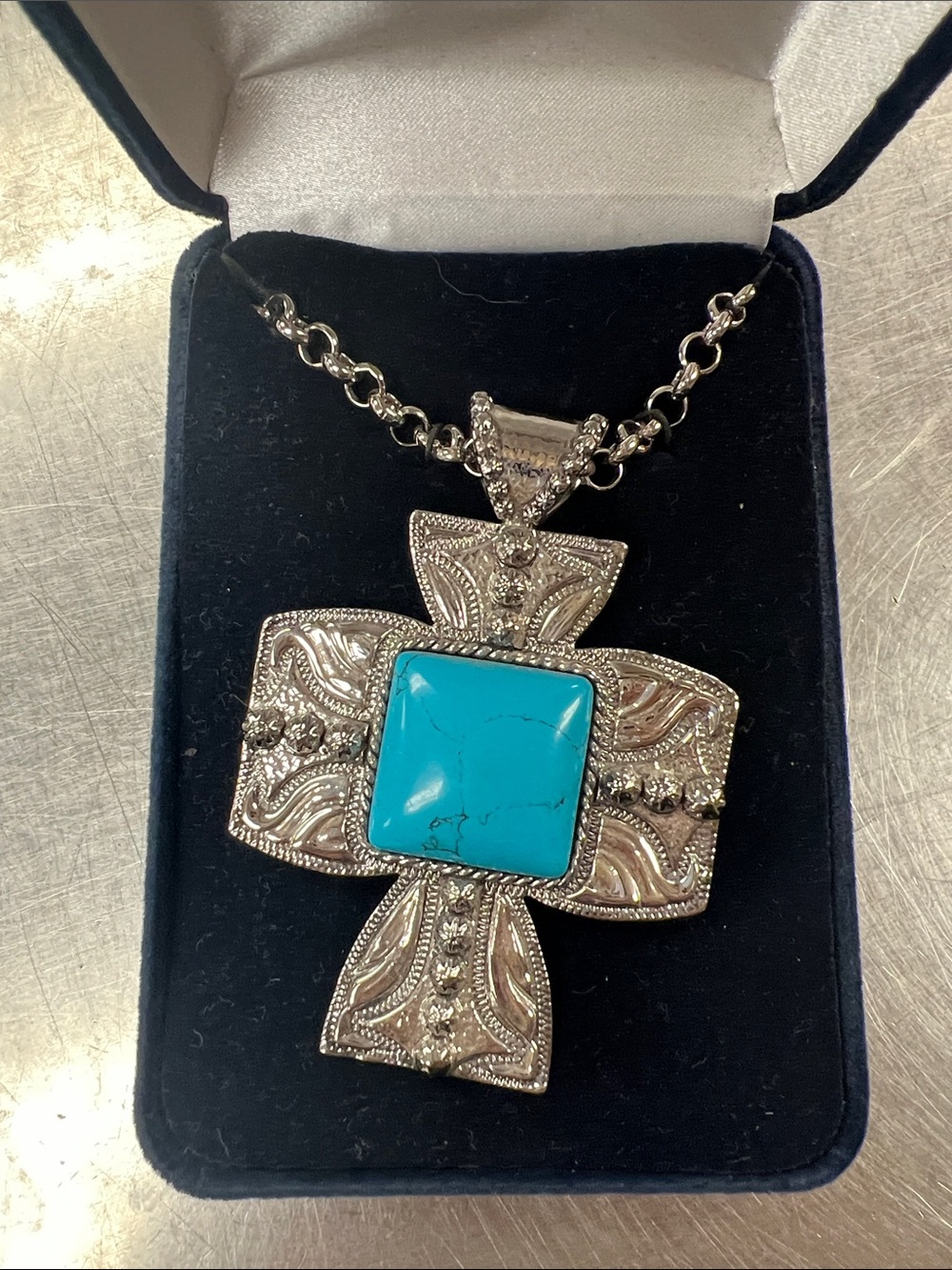 Montana Silversmith’s Silver-Tone Cross Necklace with Turquoise Center